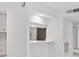 Bright white kitchen featuring a breakfast bar, and stainless steel appliances at 213 Tuxworth Cir, Decatur, GA 30033