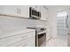 Bright kitchen features white cabinets, stainless appliances, and a pantry at 213 Tuxworth Cir, Decatur, GA 30033