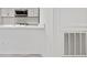 Bright kitchen features white cabinets and countertops and stainless steel faucet at 213 Tuxworth Cir, Decatur, GA 30033