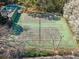 Aerial view of tennis courts surrounded by trees and white blossoms at 213 Tuxworth Cir, Decatur, GA 30033