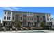 Townhome exteriors overlooking pool area with lounge chairs for residents to enjoy on sunny days at 2664 Brookview Nw Ln, Atlanta, GA 30318
