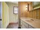 Bathroom featuring vanity, ornate mirror, patterned wallpaper and shower with curtain at 5110 Jett Forest Trl, Atlanta, GA 30327