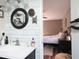 Stylish bathroom with modern fixtures and a decorative mirror, connects to a cozy bedroom with neutral tones at 86 Kelly Ct, Dallas, GA 30157