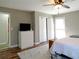 Bright bedroom includes a double closet, a window, and hardwood floors at 86 Kelly Ct, Dallas, GA 30157