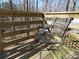 Outdoor deck featuring natural wood with an open metal chair at 86 Kelly Ct, Dallas, GA 30157