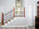 Entryway features modern railing and leads to a bright, inviting hallway, creating a welcoming first impression at 86 Kelly Ct, Dallas, GA 30157