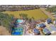 Aerial view of community with lake, pool, tennis court, and playground at 194 Lakestone Parkway, Woodstock, GA 30188