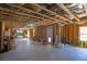 Unfinished basement with concrete floor, wood studs and visible ceiling joists at 194 Lakestone Parkway, Woodstock, GA 30188
