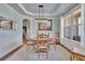 Charming dining room with elegant lighting and ample natural light at 194 Lakestone Parkway, Woodstock, GA 30188