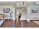 Spacious foyer with hardwood floors, staircase, and elegant architectural details at 194 Lakestone Parkway, Woodstock, GA 30188
