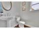 Elegant half bathroom with stylish sink, toilet, and fixtures, offering convenience and functionality at 194 Lakestone Parkway, Woodstock, GA 30188