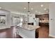 Expansive kitchen area with granite counters and bar stool seating at 194 Lakestone Parkway, Woodstock, GA 30188