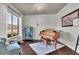 Cozy living room with hardwood floors, large window, and stylish decor at 194 Lakestone Parkway, Woodstock, GA 30188
