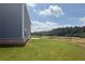 Spacious green backyard features a newly sodded lawn and a treeline in the distance at 3191 Morris Hills Dr, Dacula, GA 30019