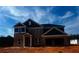 Two story brick home with black shutters under a blue sky at 3191 Morris Hills Dr, Dacula, GA 30019