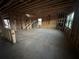 Unfinished construction of a home showing exposed wooden frames, open floor plan and staircase at 3191 Morris Hills Dr, Dacula, GA 30019