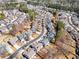 Community aerial view, showcasing the neighborhood's layout, landscaping, and proximity to woodlands at 441 Highlands Loop, Woodstock, GA 30188