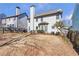 Large backyard with a combination of grassy and mulched areas, perfect for outdoor activities and entertainment at 441 Highlands Loop, Woodstock, GA 30188
