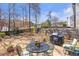 Backyard featuring a patio with outdoor seating and a grill, perfect for entertaining and enjoying the outdoors at 441 Highlands Loop, Woodstock, GA 30188