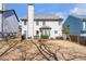 View of the home's backyard with a wooden fence and patio area at 441 Highlands Loop, Woodstock, GA 30188
