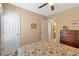 Bedroom with neutral walls, ceiling fan, and adjoining room at 441 Highlands Loop, Woodstock, GA 30188