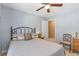 Bedroom featuring a ceiling fan, comfortable bed, and a neutral color scheme at 441 Highlands Loop, Woodstock, GA 30188