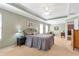 The bedroom is well lit, and spacious with a sitting area, neutral walls, and carpeting at 441 Highlands Loop, Woodstock, GA 30188