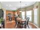 Cozy dining area with hardwood floors and natural light, adjacent to the kitchen at 441 Highlands Loop, Woodstock, GA 30188