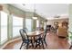 Dining area featuring hardwood floors and natural light from the bay windows at 441 Highlands Loop, Woodstock, GA 30188