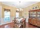 Dining room with hardwood floors, china cabinet, and traditional decor at 441 Highlands Loop, Woodstock, GA 30188