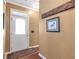 Traditional entryway featuring a white door, wood trim, and a patterned area rug at 441 Highlands Loop, Woodstock, GA 30188
