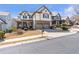 Beautiful two-story home featuring a well-manicured lawn, a two-car garage, and a brick and siding facade at 441 Highlands Loop, Woodstock, GA 30188