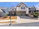 Charming two-story home with a well-maintained lawn, a two-car garage, and a welcoming front porch at 441 Highlands Loop, Woodstock, GA 30188