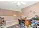 Home office area with desk, chair, and ceiling fan for comfort at 441 Highlands Loop, Woodstock, GA 30188