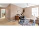 Home office with a desk, chair, and natural light streaming in from a window at 441 Highlands Loop, Woodstock, GA 30188