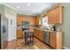 Traditional kitchen with stainless steel appliances, granite countertops and wood cabinets at 441 Highlands Loop, Woodstock, GA 30188