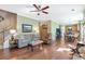 Open-concept living room featuring hardwood floors and a staircase leading to the upper level at 441 Highlands Loop, Woodstock, GA 30188