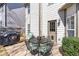 Patio with a table and chairs for outdoor dining, plus a grill, all surrounded by landscaping at 441 Highlands Loop, Woodstock, GA 30188