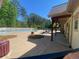 Community pool area with lounge chairs and shaded seating at 441 Highlands Loop, Woodstock, GA 30188