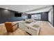 Spacious finished basement featuring stylish seating, modern lighting, ping pong table, and neutral decor at 7560 Wild Violet Dr, Cumming, GA 30040