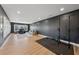 Large finished basement with home office, workout area, and comfortable seating for relaxing and recreation at 7560 Wild Violet Dr, Cumming, GA 30040