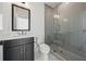 Modern bathroom with stylish vanity, toilet, and a sleek, glass-enclosed shower at 7560 Wild Violet Dr, Cumming, GA 30040