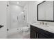 Beautiful bathroom featuring a shower with sleek doors, vanity, and new toilet at 7560 Wild Violet Dr, Cumming, GA 30040