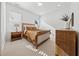 Bright bedroom with large windows, neutral colors, and carpet at 7560 Wild Violet Dr, Cumming, GA 30040