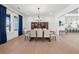 Formal dining room featuring classic furnishings and bright windows at 7560 Wild Violet Dr, Cumming, GA 30040