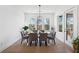Bright dining room featuring a modern chandelier and access to an outdoor space at 7560 Wild Violet Dr, Cumming, GA 30040