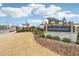 An inviting community entrance with stone accents and manicured landscaping at 7560 Wild Violet Dr, Cumming, GA 30040