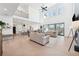 Open living area with high ceilings and a cozy fireplace at 7560 Wild Violet Dr, Cumming, GA 30040