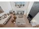 Open-concept living room with high ceilings, fireplace, and modern furniture at 7560 Wild Violet Dr, Cumming, GA 30040