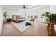 Spacious main bedroom suite with hardwood floors, natural light, and sitting area at 7560 Wild Violet Dr, Cumming, GA 30040